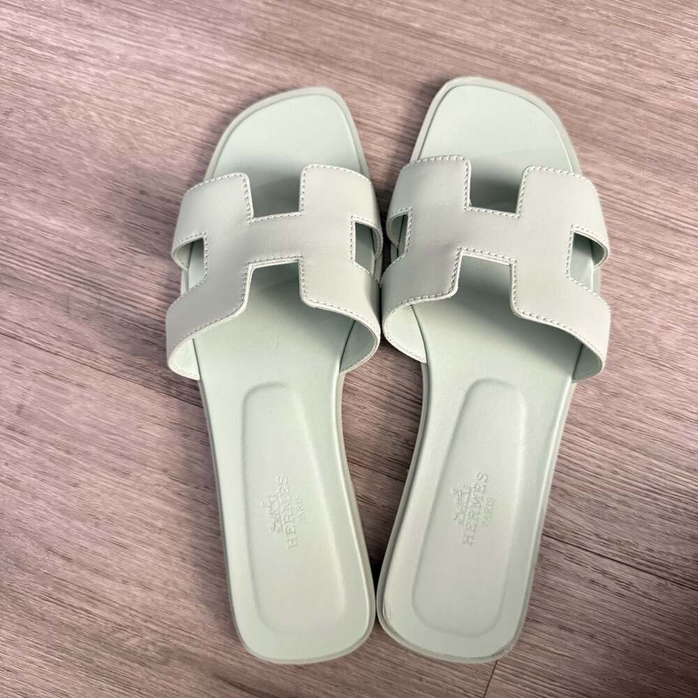 Hermès Oran Flat Slides in Vert D'eau Calfskin